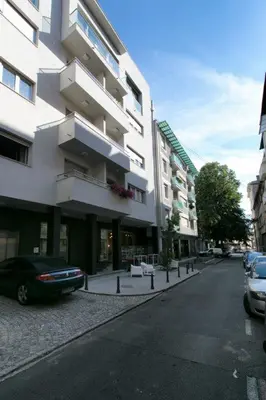 a car parked on a street next to a building at Apartment 32 in Belgrade