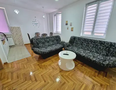 a living room with a couch and a table at Tami in Belgrade