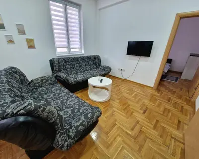 a living room with a couch and a chair at Tami in Belgrade