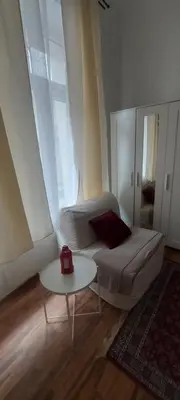 a living room with a couch and a table at Tsar Dušan Apartment in Belgrade