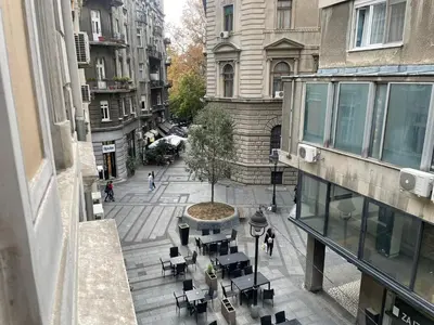 an overhead view of a city street with tables and chairs at Nikolas 2 in Belgrade