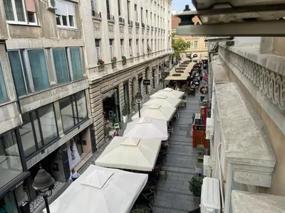 an overhead view of a street with white umbrellas at Nikolas 2 in Belgrade