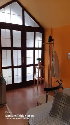 a room with a large glass door in a room at Fly in Dobanovci