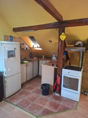a kitchen with a stove and a refrigerator at Fly in Dobanovci