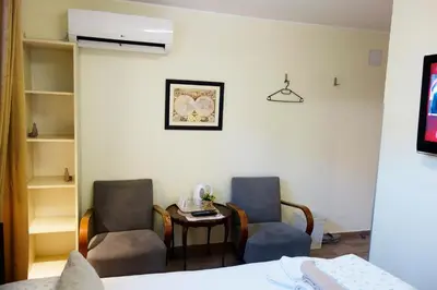 a hospital room with two chairs and a table at Villa Loop Beograd in Belgrade