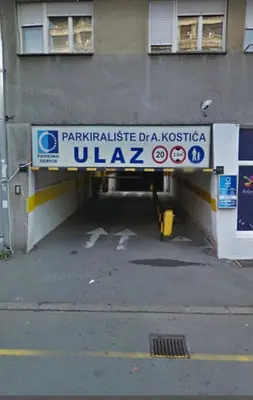 a entrance to a building with a sign on it at Urban Oasis Apartment in Sajmište