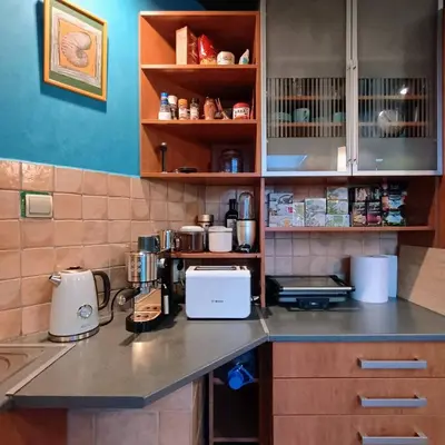 a kitchen counter with a coffee maker on it at On The Terrace La Vida Joy Mansard Top Kitchen in Belgrade
