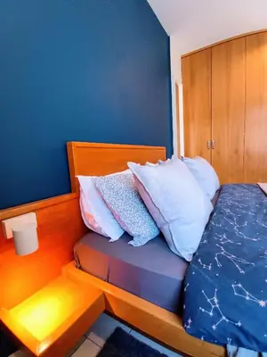 a bedroom with a bed with pillows on it at On The Terrace La Vida Joy Mansard Top Kitchen in Belgrade