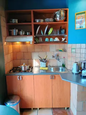 a kitchen with a sink and a counter top at On The Terrace La Vida Joy Mansard Top Kitchen in Belgrade