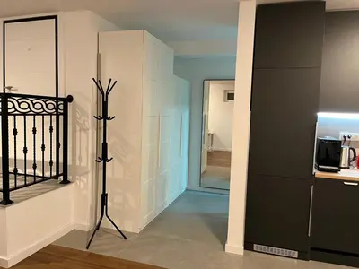 a living room with a refrigerator and a microwave at GardenGateStudio in Belgrade
