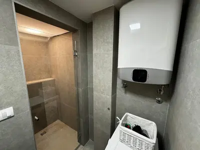 a bathroom with a shower and a walk in shower at GardenGateStudio in Belgrade