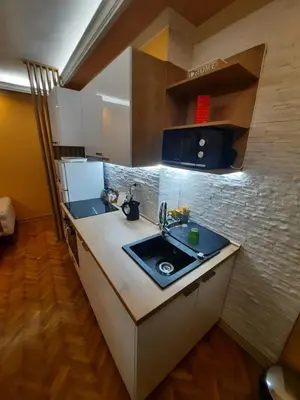 a kitchen with a sink and a counter top at G&S apartment in Novi Beograd