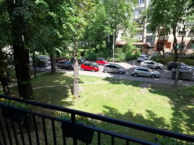 a balcony with cars parked in a parking lot at G&S apartment in Novi Beograd
