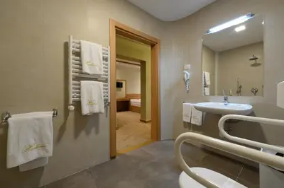 a bathroom with a sink and a mirror at Hotel Hedonic in Belgrade