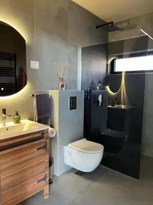 a bathroom with a toilet and a sink at Chado Belgrade in Belgrade