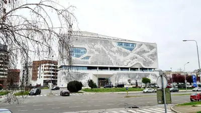 a large white building with a lot of windows at All In One Studio in Belgrade
