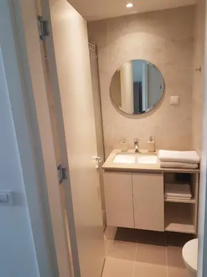 a bathroom with a sink and a mirror at All in One Belgrade Waterfront in Sajmište