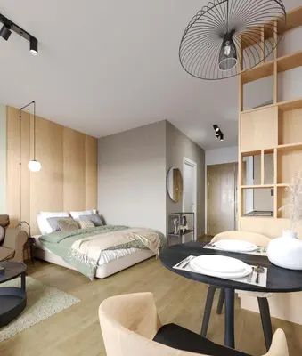 a bedroom with a bed and a table at IVA HOME Apartment in Belgrade