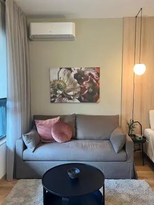 a living room with a couch and a table at IVA HOME Apartment in Belgrade