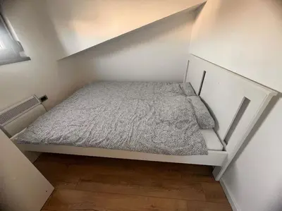 a small bedroom with a bed in a room at Daki apartment in Belgrade