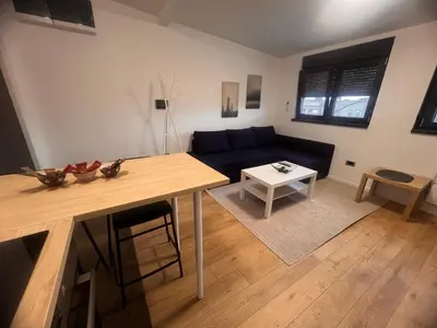 a living room with a couch and a table at Daki apartment in Belgrade