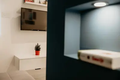 a view of a bathroom with a mirror and a bed at Sweet Home in Belgrade