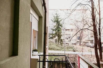 an apartment balcony with a view of a street at Sweet Home in Belgrade