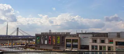 a view of a city with buildings and a bridge at inJoy in Sajmište