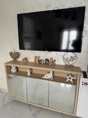 a flat screen tv sitting on top of a entertainment center at Airport vicinity Apartment Star 1 in Belgrade