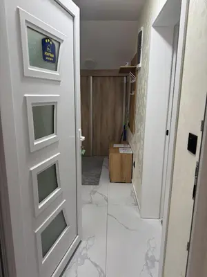 a door in a room with a tile floor at Airport vicinity Apartment Star 1 in Belgrade