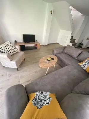 a living room with a couch and a table at ŠTAB 1 City Centre (free parking) Dorćol in Belgrade