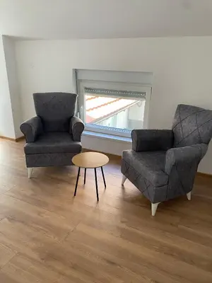 a living room with two chairs and a table at ŠTAB 1 City Centre (free parking) Dorćol in Belgrade