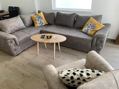 a living room with a couch and a table at ŠTAB 1 City Centre (free parking) Dorćol in Belgrade