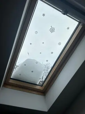 a window in a room with snowflakes on the ceiling at ŠTAB 2 City Centre (free parking) Dorcol in Belgrade