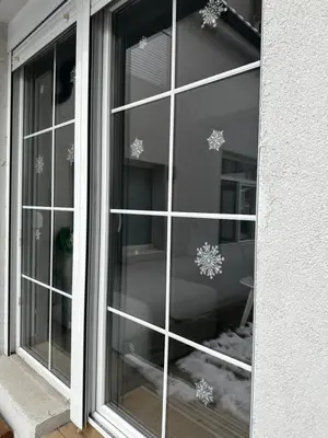 a glass window with snowflakes on it at ŠTAB 2 City Centre (free parking) Dorcol in Belgrade