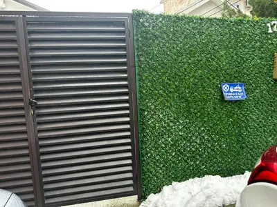 a bush with a gate and a sign on it at ŠTAB 2 City Centre (free parking) Dorcol in Belgrade