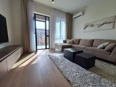 a living room with a couch and a tv at Crown Apartments - BW Sole in Belgrade