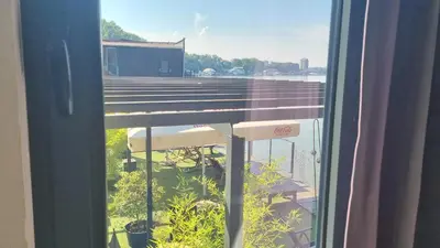 an open window with a view of a building at B&B Botel Charlie in Belgrade