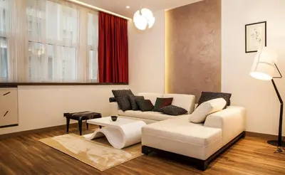 a living room with two white couches and a table at Atera Business Suites in Belgrade