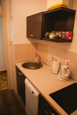 a kitchen with a sink and a counter top at Apartment Arena White in Belgrade