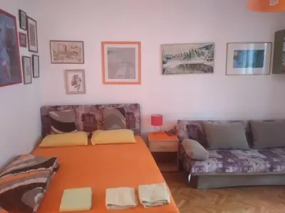 a living room with a couch and a table at Orange Place Studio in Belgrade