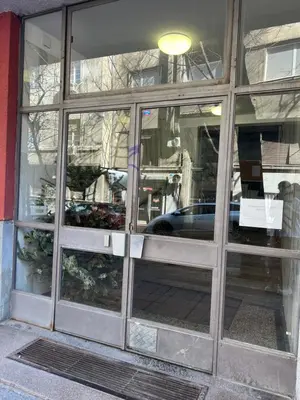a window of a store with a car in it at Orange Place Studio in Belgrade