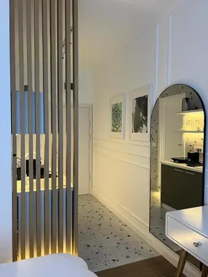 a room with a mirror and a table and a kitchen at RED RIDING HOOD in Belgrade