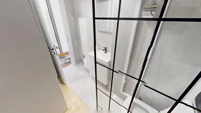 a bathroom with a toilet and a glass shower at Luka in Belgrade