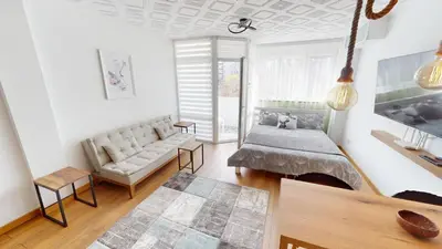 a living room with a couch and a table at Luka in Belgrade