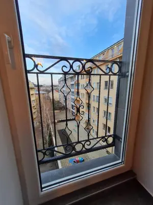 a window with a view of a building at Mansarda, Belgrade in Belgrade