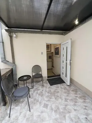 a room with chairs and a table and a door at Galerija MARSHAL in Belgrade