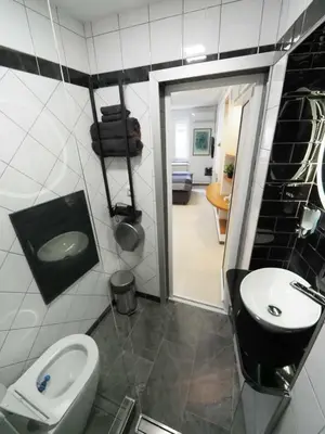 a bathroom with a toilet and a sink at Galerija MARSHAL in Belgrade