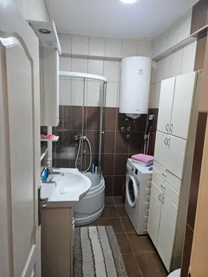a small bathroom with a sink and a toilet at Relax 2, sa parkingom in Obrenovac