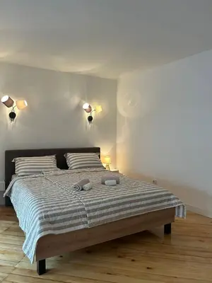 a bedroom with a large bed with two pillows at Kosancic No.1 in Belgrade